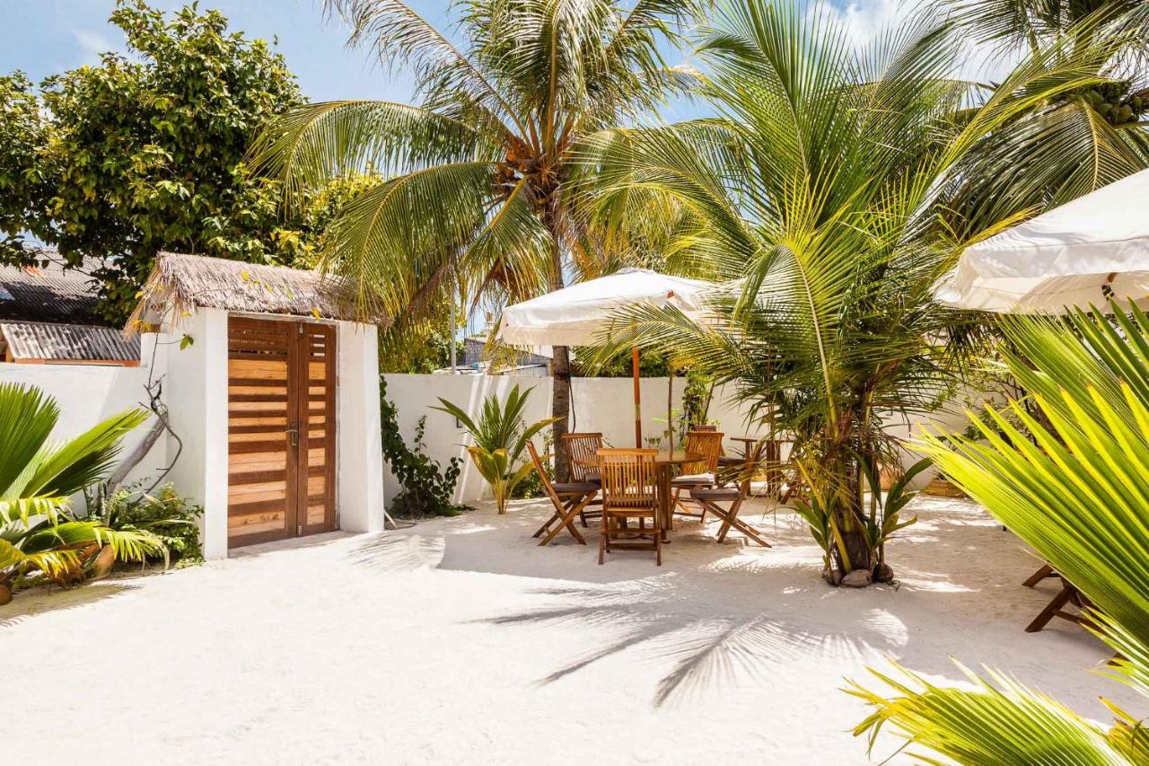 Experience exceptional hospitality at Bito's Guest House. This highly-rated guest house boasts comfortable rooms with air conditioning, some with balconies offering stunning sea views.