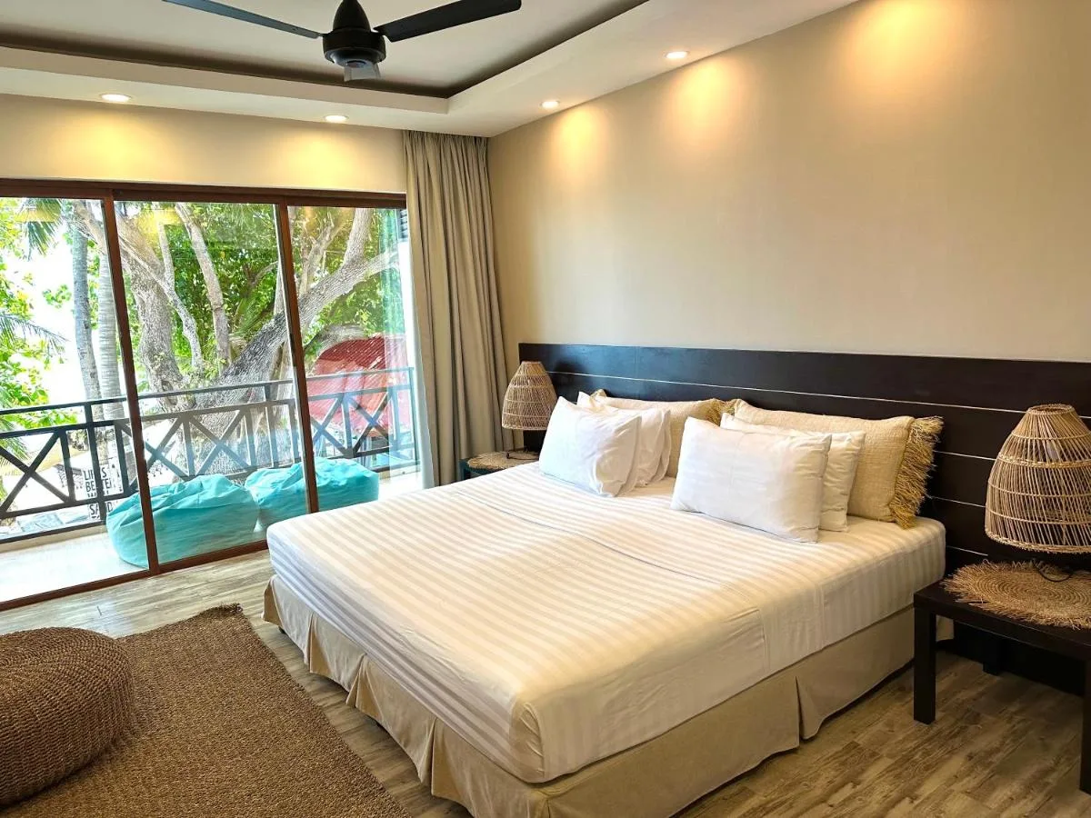 Experience beachfront bliss with a touch of luxury at Canopus Retreat. This upscale guest house boasts stylish rooms, some with balconies, a restaurant serving delicious meals, and a spa offering rejuvenating treatments.