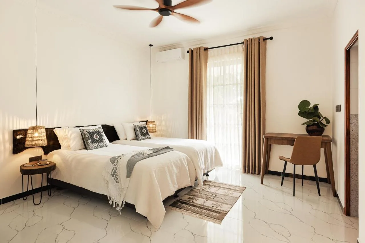 Cove Fehendhoo is a spacious villa comes with 3 separate bedrooms, 3 bathrooms, a fully equipped kitchen with a dining area and dishwasher, and a living room with a flat-screen TV.