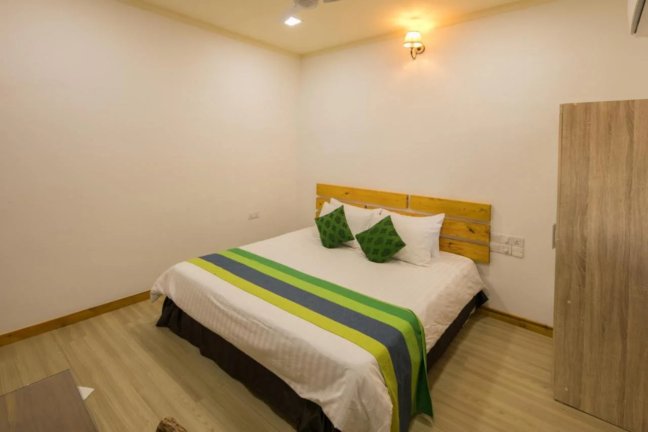 Holiday Garden Rasdhoo is a friendly guest house with comfortable rooms, a garden, and easy access to the beach.