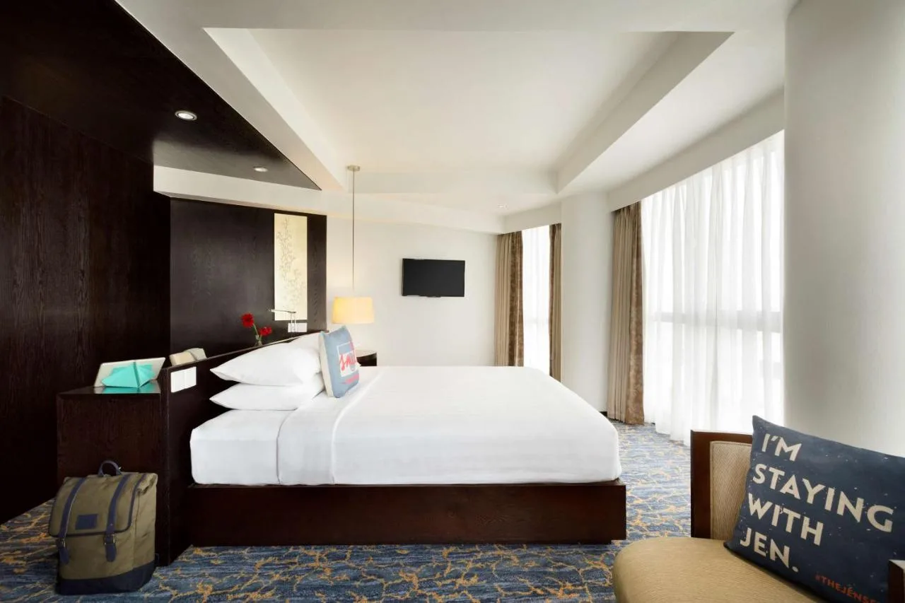 Immerse yourself in Maldivian luxury at JEN Maldives Malé by Shangri-La. This stylish hotel offers stunning ocean views, a rooftop pool, and a variety of dining options.