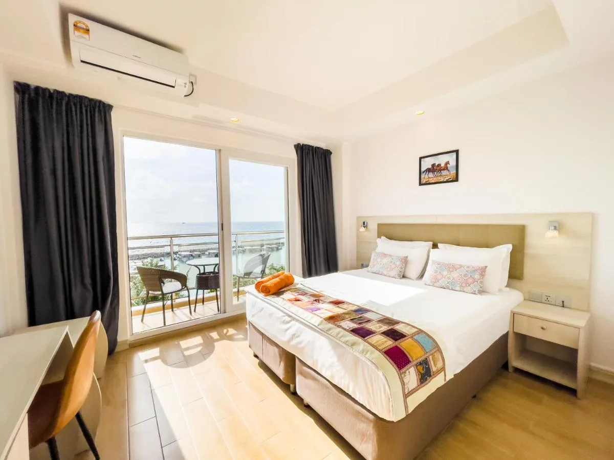 Immerse yourself in island life at iCom Marina Sea View. This centrally located guest house offers comfortable accommodations and easy access to the island's vibrant shops and restaurants.