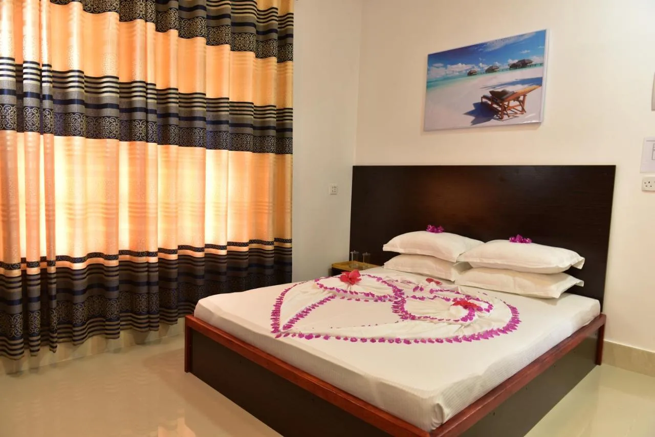 Embrace the tranquility of Guraidhoo at Moodhumaa Inn. This peaceful guest house offers comfortable rooms in a relaxed atmosphere.
