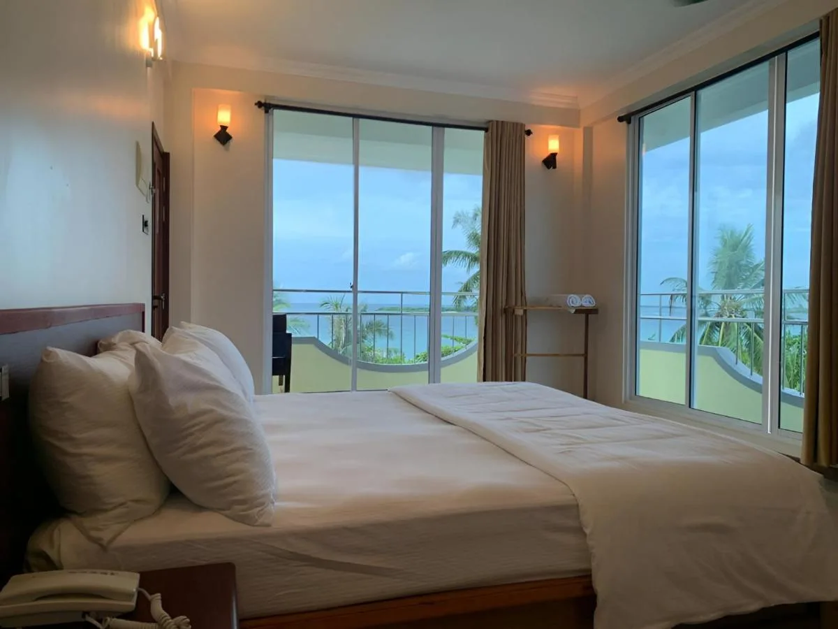 Experience beachfront bliss at Noah Beach House. This modern guest house boasts stylish rooms with balconies offering stunning ocean views.