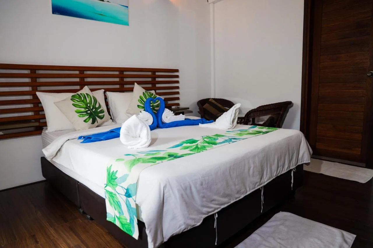 Palm Residence is a family-run guest house with spacious rooms, a restaurant, and a garden area.